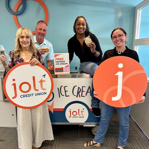 Jolt employees holding up ice cream for Member Appreciation Days at Main branch in Saginaw.
