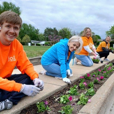 Jolt employees planting flowers in support of Midland Blooms in Midland, Michigan.