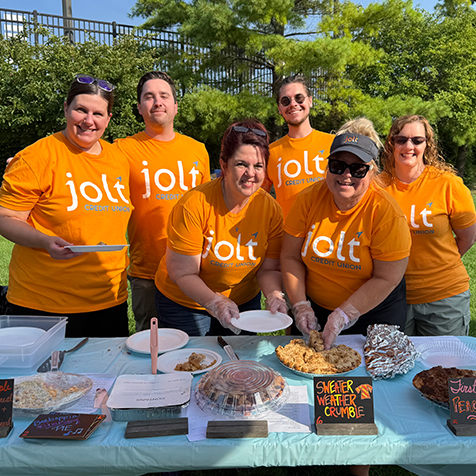 Jolt employees serving pie from 2025 Midland Area Farmers Market Pie Bake-Off