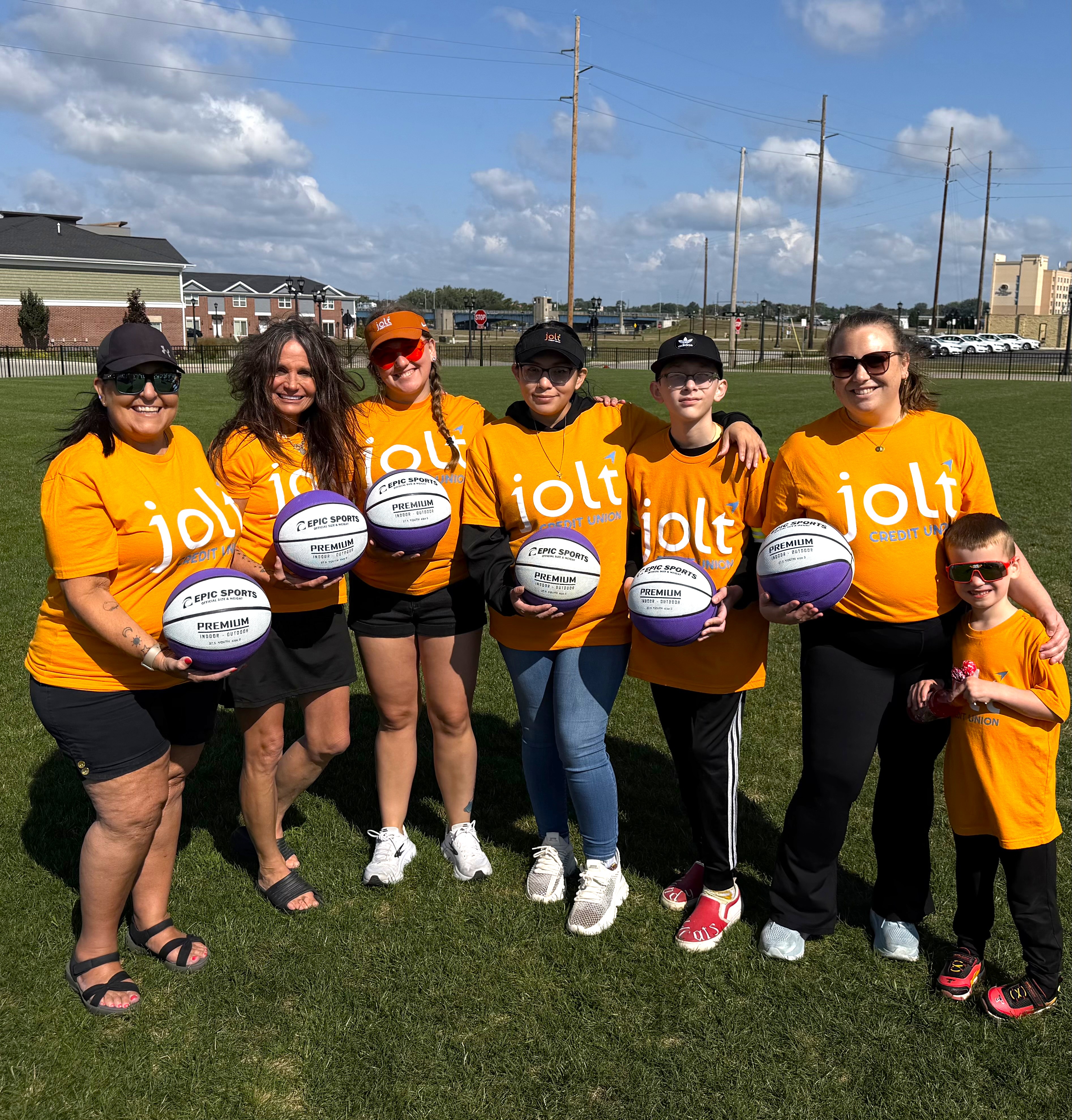 Jolt employees posing at the Kobe Day event at the YMCA in Bay City