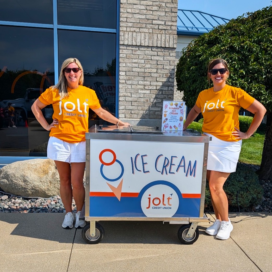 Two Jolt employees celebrating the return of Jolt's Ice Cream Cart