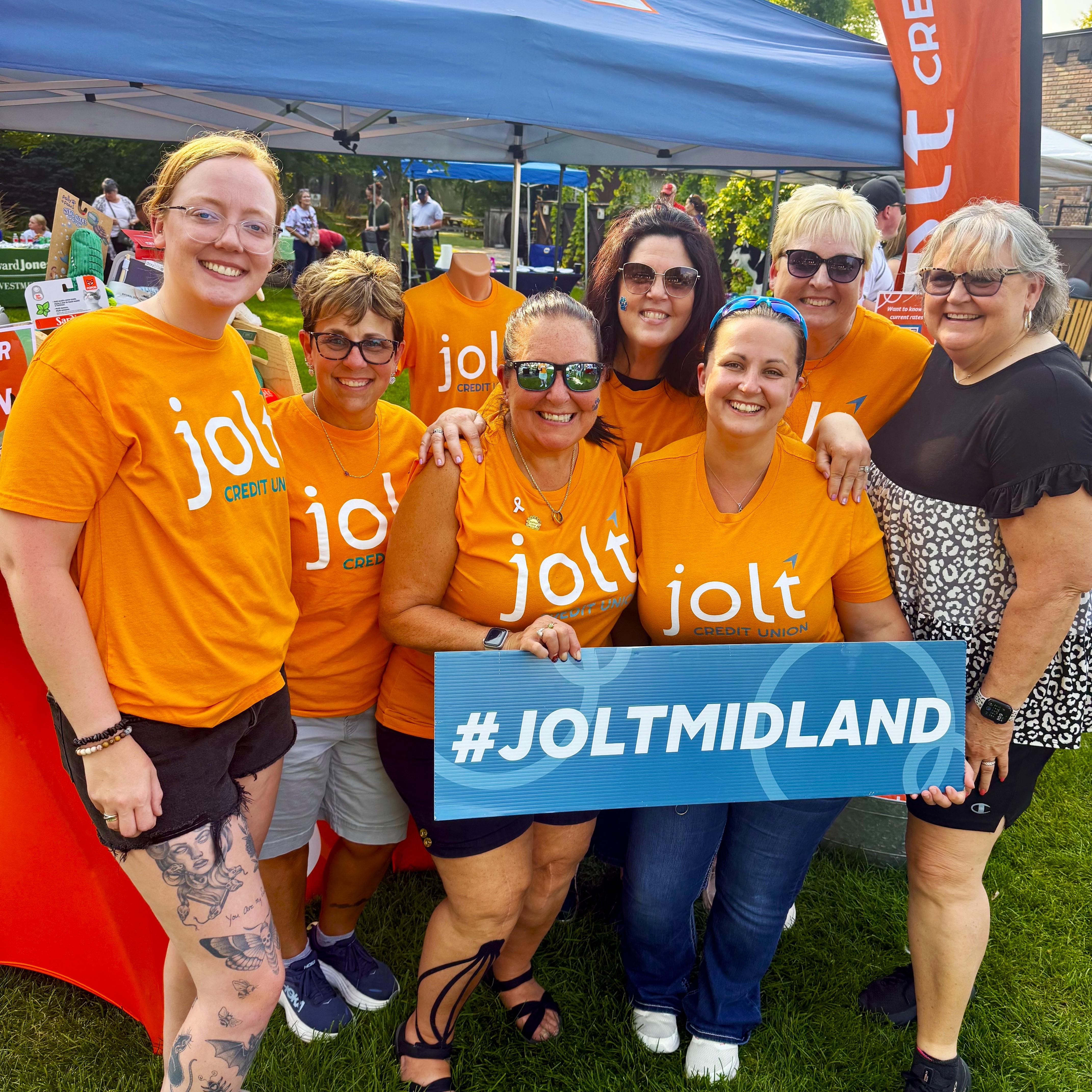 Jolt employees posing at the Pints for Pups event in Midland Michigan