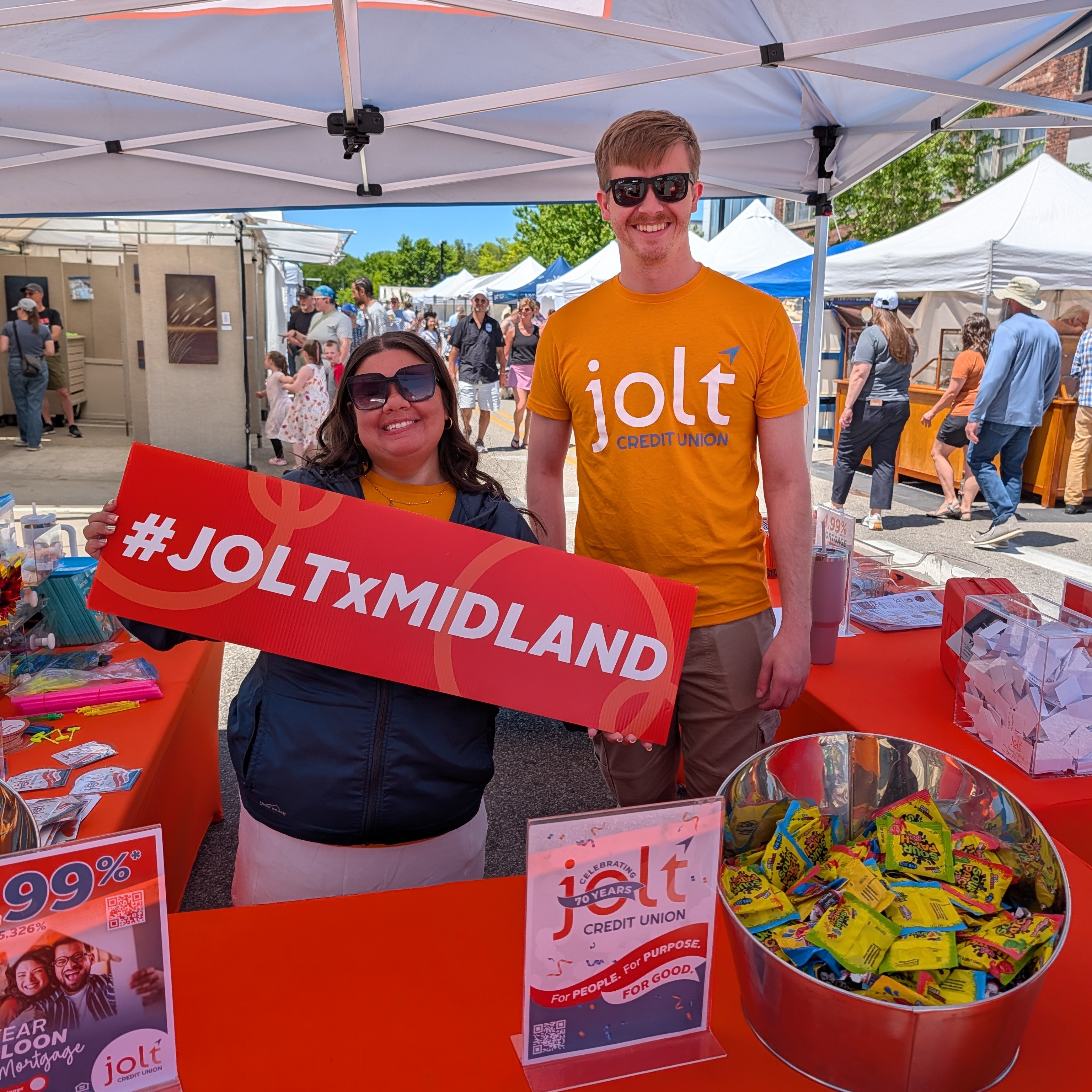 Jolt employees posing at the Midland art fair