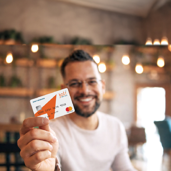 Man holding Jolt Debit Card