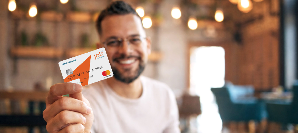 Man holding Jolt Debit Card