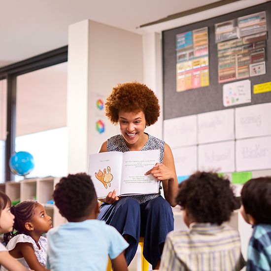 Teacher reading story to children