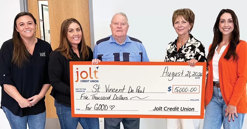 Jolt Credit Union presents a $5,000 check to St. Vincent De Paul.
