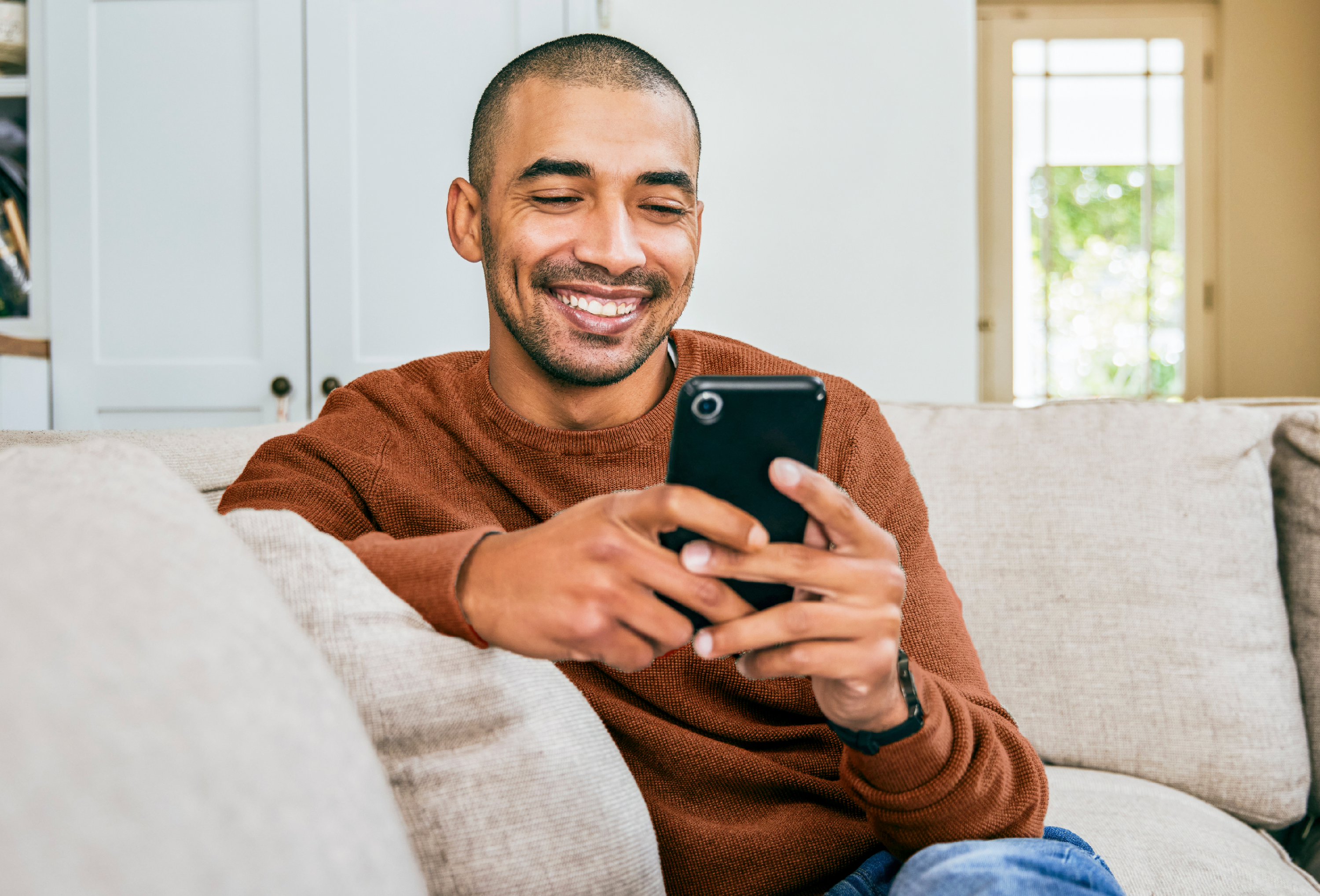 man looking at cell phone