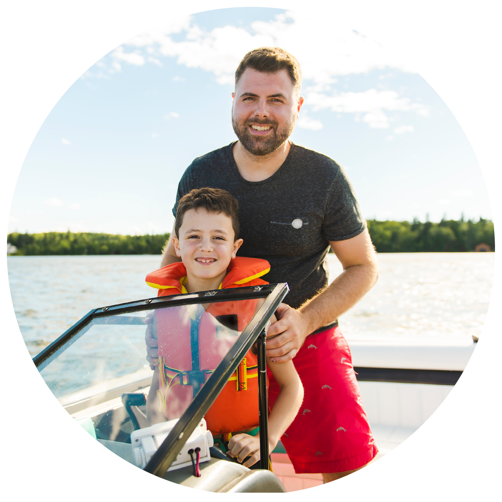 dad and son on boat